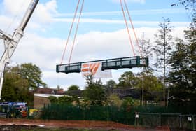 Serpentine Lake bridge is lowered into place by crane at Moor Park, Preston. Photo: Kelvin Lister-Stuttard