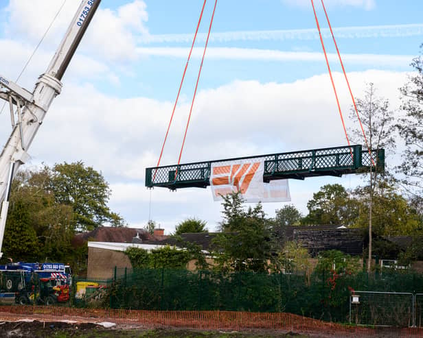 Serpentine Lake bridge is lowered into place by crane at Moor Park, Preston. Photo: Kelvin Lister-Stuttard