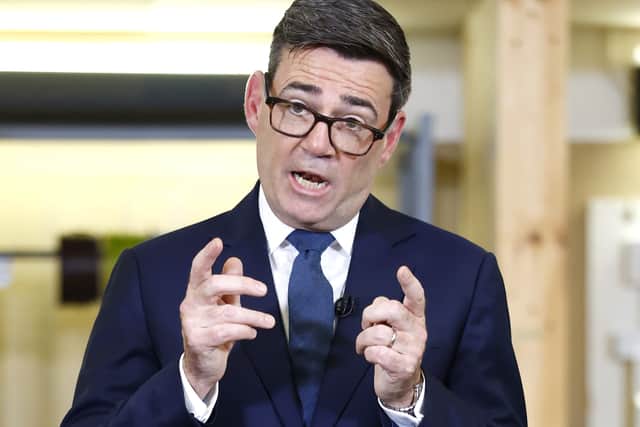 Andy Burnham gestures while speaking