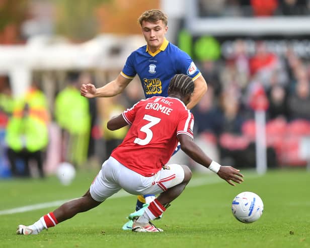 Preston North End's Ed Nolan battles with  Wrexham's Jacques Ekomie