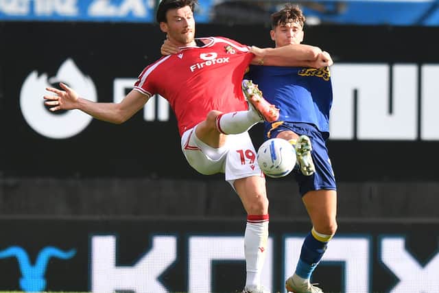 Preston North End's Jordan Storey battles with  Wrexham's Kieffer Moore