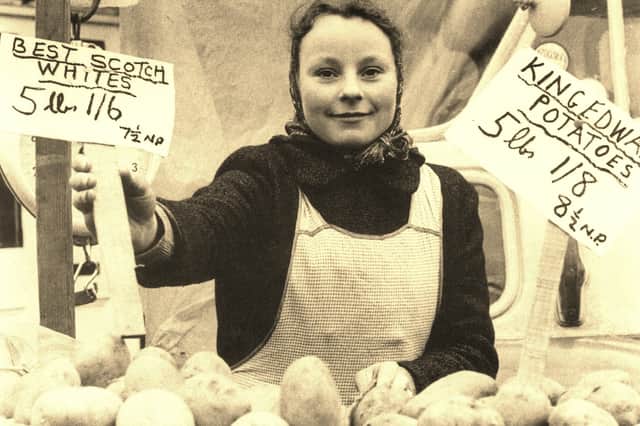 A Chorley Market trader selling potatoes in 1971, with Scotch Whites advertised at 1s 6d for 5lb and King Edwards at 1s 8d