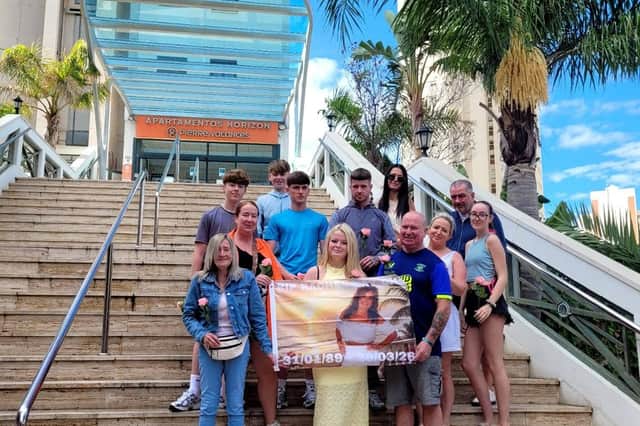 Rachel's family unfurled a banner of their ‘Special Kay’ on the steps of the apartment complex where the 37-year-old sadly died in March