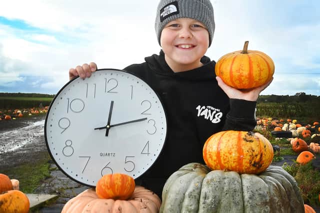 Ronnie, nine, having Halloween fun at The Pumpkin Patch at Bradshaw's Farm Shop and Garden Centre, Garstang, reminding readers clocks go back by one hour this Sunday at 2am, shifting from British Summer Time (BST) to Greenwich Mean Time (GMT).  