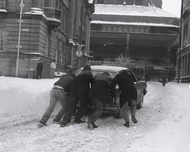 A winter wonderland – but not for motorists! A car is pushed through the snow on Preston’s Flag Market in 1981, as our nostalgic photo series revisits the people, places and memorable moments of the Eighties  