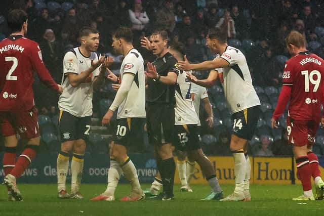 Preston North End players remonstrate with referee Elliot Bell