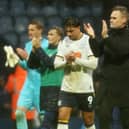 Preston North End manager Graham Alexander  applauds the fans at the final whistle.