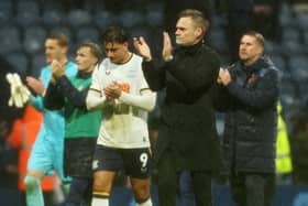 Preston North End manager Graham Alexander  applauds the fans at the final whistle.