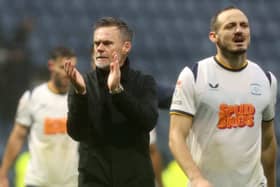 Preston North End manager Graham Alexander  applauds the fans at the final whistle.