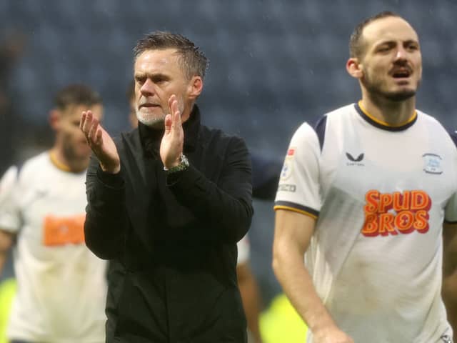 Preston North End manager Graham Alexander  applauds the fans at the final whistle.