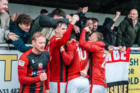 Morecambe celebrate an excellent win over Merthyr Town