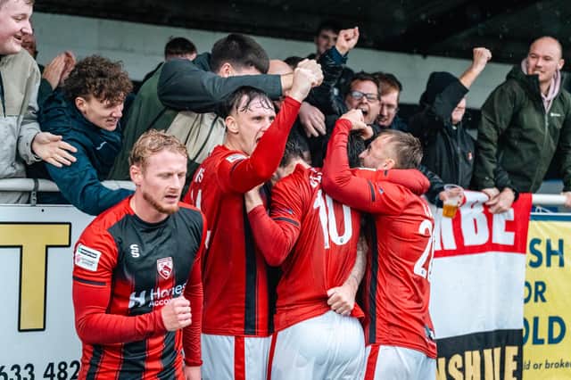 Morecambe celebrate an excellent win over Merthyr Town