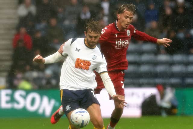 Preston North End's Stanley Mills vies for possession with West Bromwich Albion's Chris Mepham.