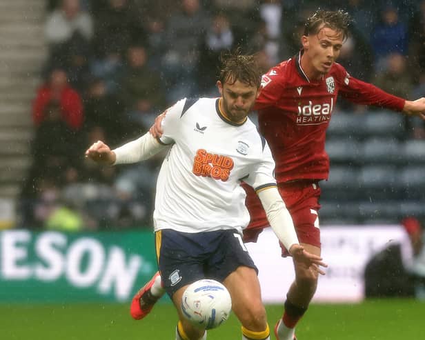 Preston North End's Stanley Mills vies for possession with West Bromwich Albion's Chris Mepham.