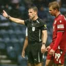 Referee Elliot Bell gestures