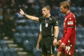 Referee Elliot Bell gestures