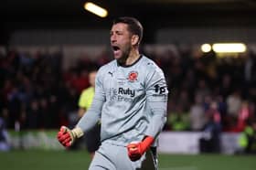 Fleetwood Town goalkeeper Jay Lynch celebrates his heroic penalty save