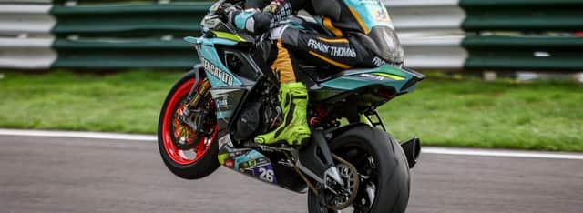 Charlie Barnes wheelies over the Cadwell Park 'Mountain'