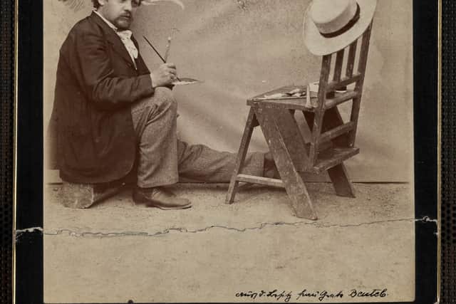 Karel Klic at work on caricatures.