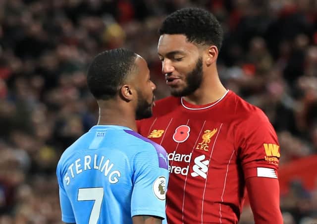 Liverpool's Joe Gomez (right) and Manchester City's Raheem Sterling clash on Sunday
