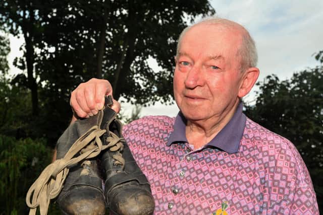 Les Campbell pictured in 2013 with the boots he wore on his Preston debut in 1953
