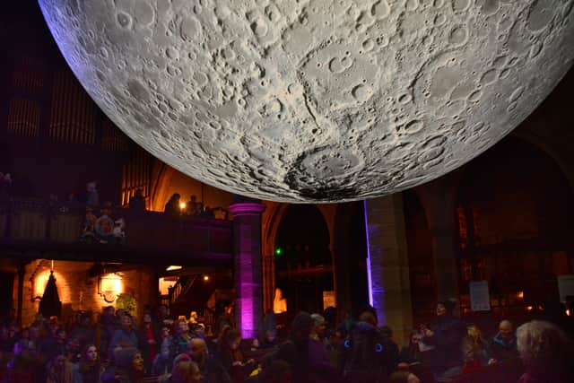 Crowds flock to Lancaster Priory to see The Moon. Photo by Darren Andrews