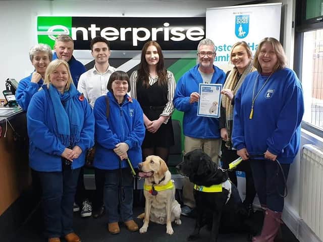 Staff at Enterprise Rent-a-car in Bamber Bridge presenting a 400 cheque in aid ofLostock Hall & Bamber Bridge Guide Dog Group.