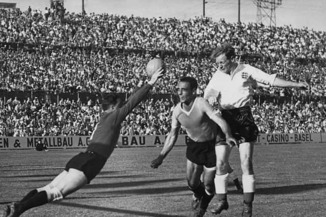 Sir Tom Finney in action for England against Uruguay in the 1954 World Cup in Switzerland - one of 76 appearances for his country