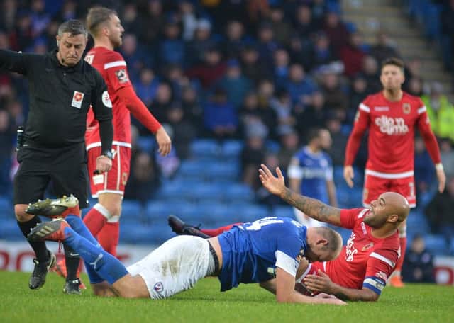 Courtney Meppen-Walter concedes a free-kick against Chesterfield