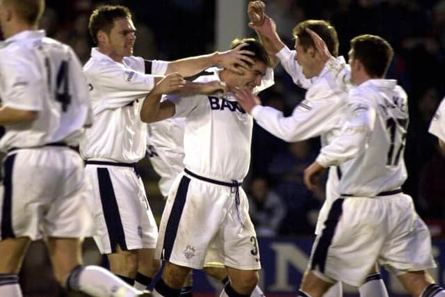 Iain Anderson is mobbed by his Preston team-mates after equalising against Walsall at the Bescot Stadium in January 2002