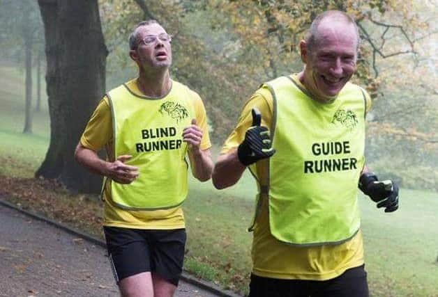 Rob Bywater, (pictured left), with his running guide Stuart Isherwood at a Preston Parkrun
