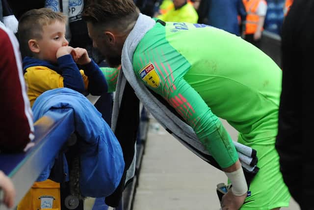 Declan Rudd has a chat with a young Preston fan at Deepdale