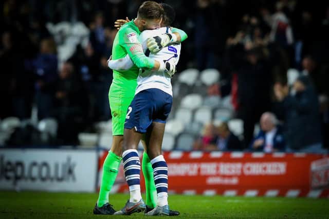 Declan Rudd shares a hug with Preston team-mate Darnell Fisher after the game against Leeds in October