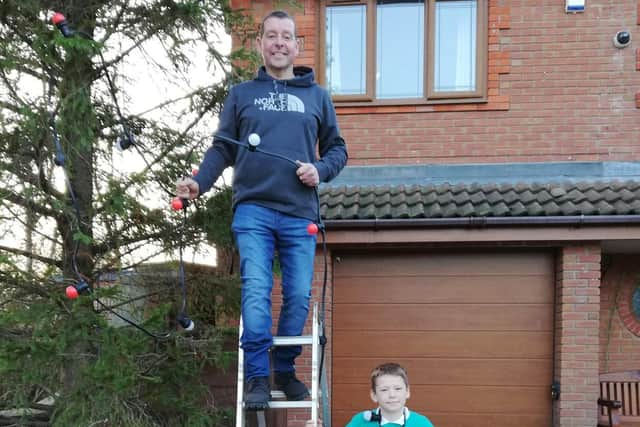 Mark Tipping with his son