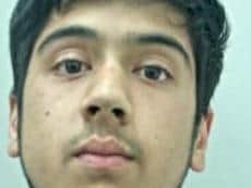 Sadakat Ali, 20, of Accrington, is wanted for punching a police officer in the face after being detained on Saturday, November 16. Pic: Lancashire Police