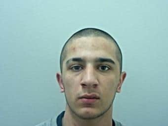 Dean Qayum, 20, is wanted in connection with the hit and run death of Alison McBlaine in Blackburn on November 19. He is believed to have a leg injury and could be using crutches. Pic: Lancashire Police