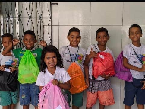 Some of the Brazilian children in a Compassion project are seen receiving gifts from representatives of Bamber Bridge's Valley Church.