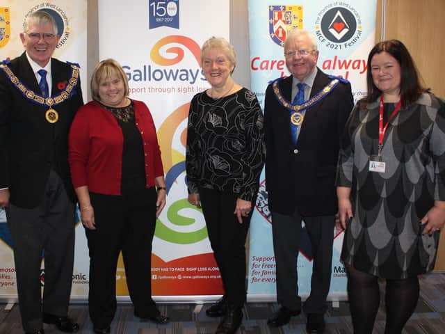 Leader of West Lancashire Freemasons Tony Harrison with partially sighted service users Linda McCann from Preston and Laurel Devey from Southport together with Nicola Hanna from Galloways Society for the Blind