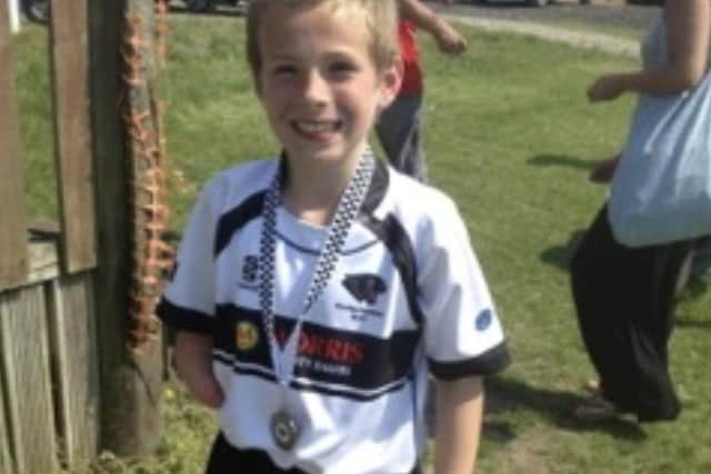 Ben Seward, aged 8, playing at a festival for Chorley Panthers