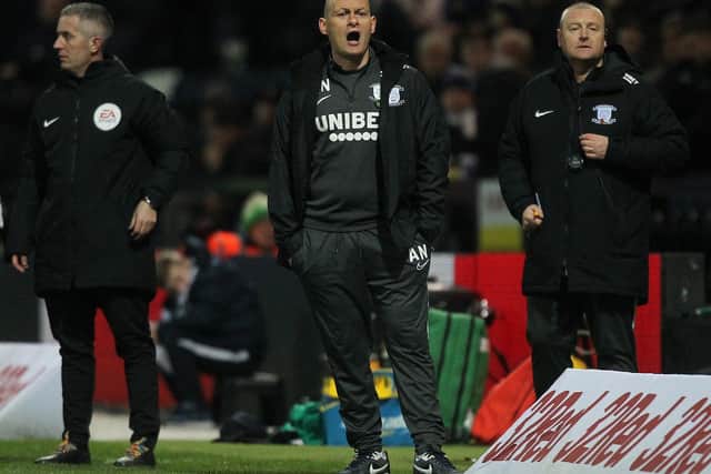 Preston manager Alex Neil and his assistant Frankie McAvoy on the touchline