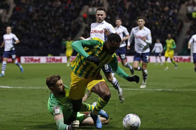 Preston goalkeeper Declan Rudd is adjudged to have fouled West Bromwich Albion substitute Kyle Edwards