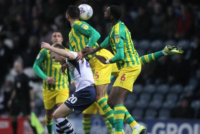 Preston striker Jayden Stockley gets some close attention from the West Bromwich Albion defence