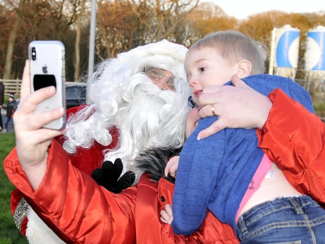 Father Christmas poses for a selfie on his Buckshaw Village Tour
