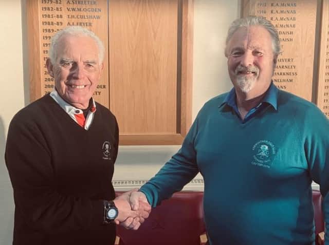 John Wilson (left) is congratulated by club captain Henry Hesketh