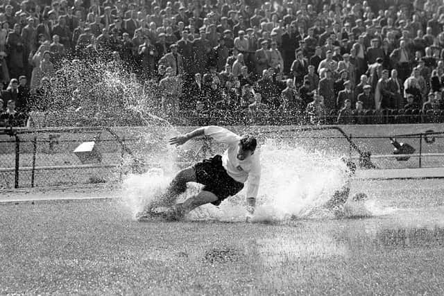 The 1956 photograph of Preston North End's Tom Finney splashing through a puddle. 
Byline:  John Horton