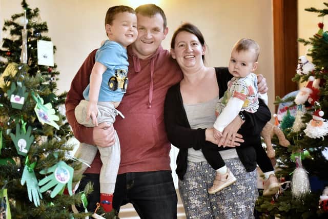 The Jackson family, David, Thomas (4), Gemma and Clara (18 months) at St Leonard's Christmas Tree Festival