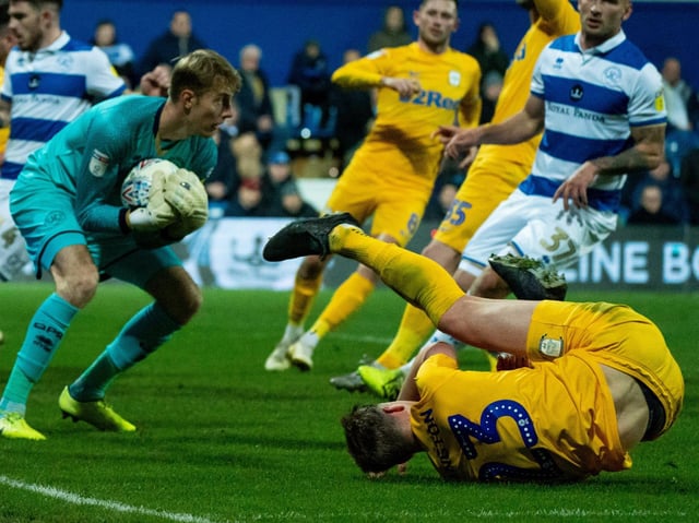 Preston centre-half Paul Huntington lands on the floor after challenging for the ball in the Queens Park Rangers box