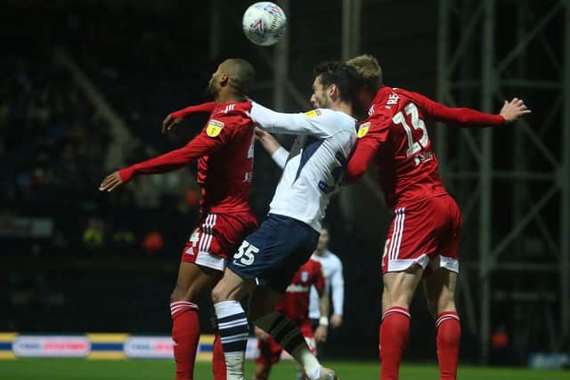 Preston striker David Nugent challenges in the air against Fulham at Deepdale