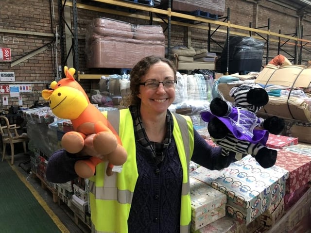 Julie Rowlandson, community ambassador for International Aid Trust, with some of the toys that have been donated to the organisation's Christmas gift appeal.