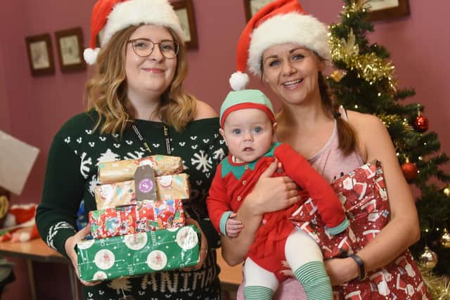 Hannah McVerry with 8-month-old Deia and Charlotte Robinson from Derian House.